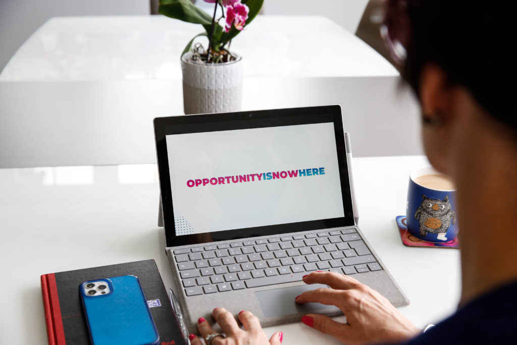 a Laptop computer with the term 'Opportunityisnowhere' written on the screen